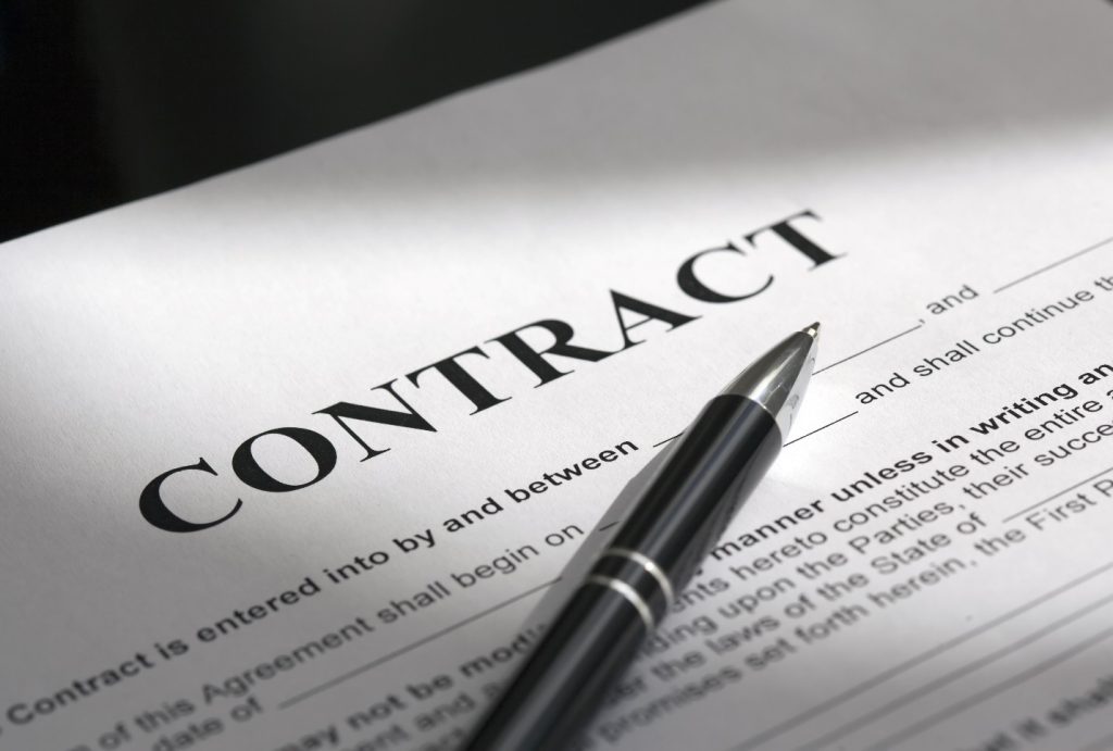 pen on the contract papers