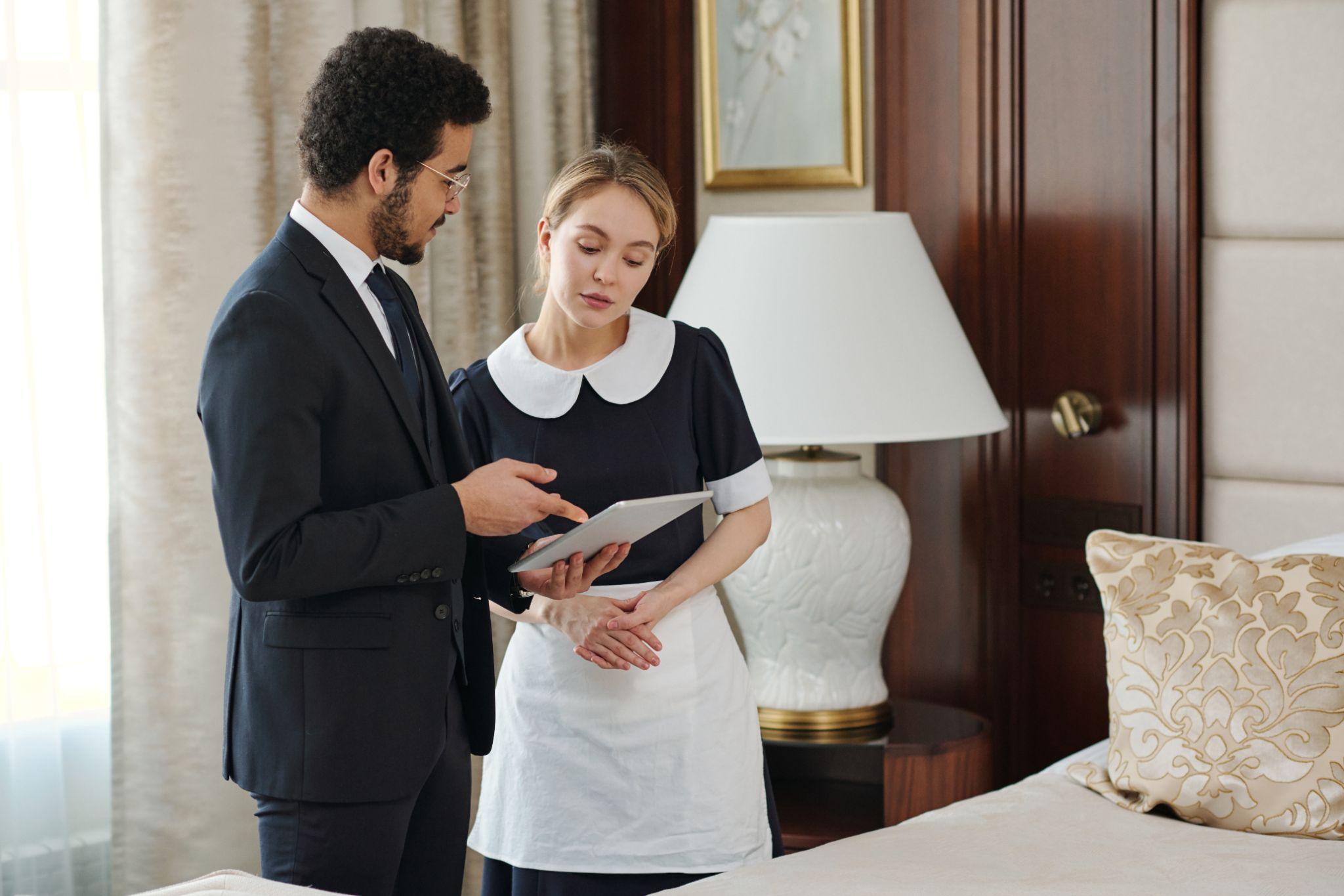Estate manager giving direction to a live in housekeeper of a luxury home