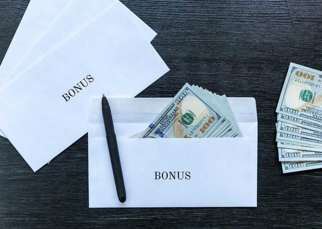 Bonus envelopes with one hundred dollar bill sin them