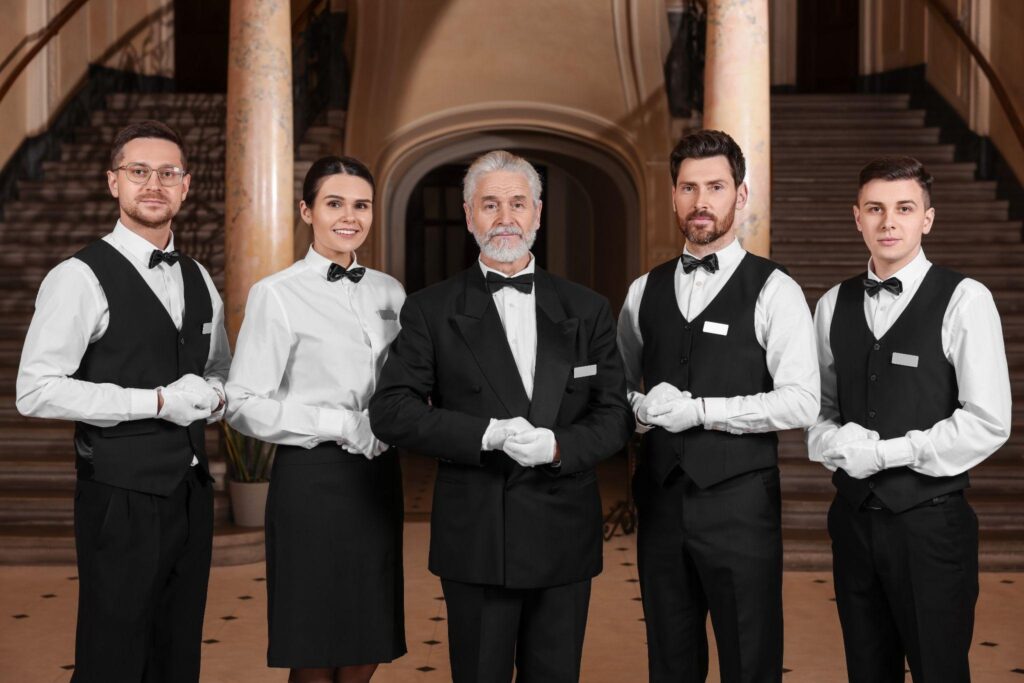 Butlers standing in the entrance of a home