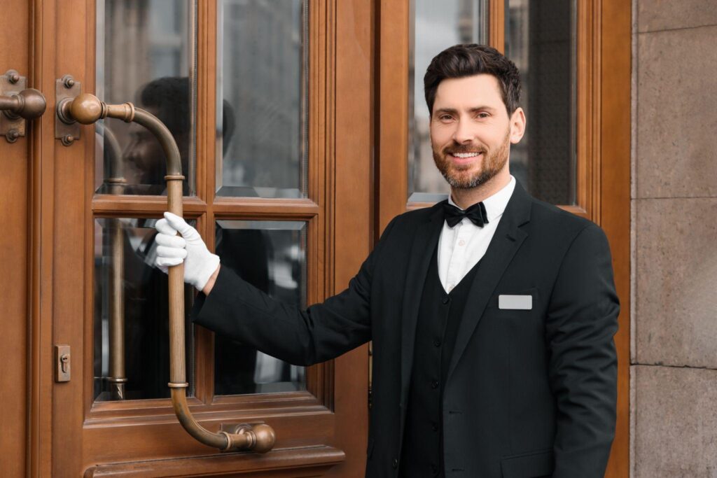 Private household butler opeing the front door