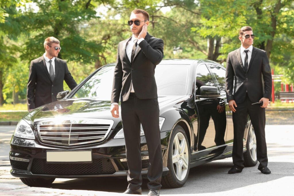 Private security team standing in front of a vehicle